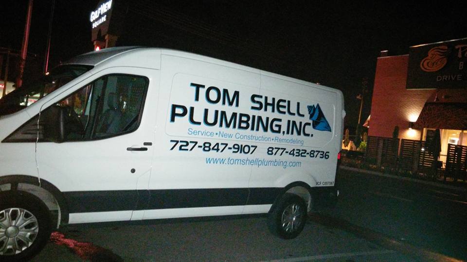 Plumbing van parked in a commercial area