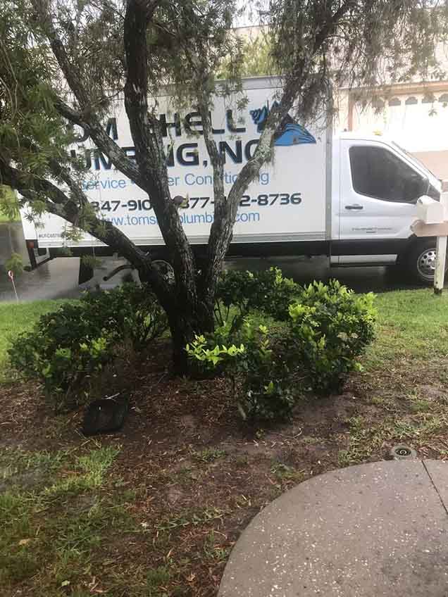 Plumbing Truck Parked Outside a Residential Area